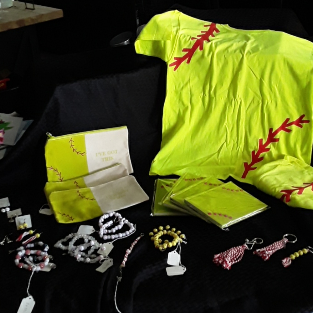 Lot of softball and baseball gifts and goodies